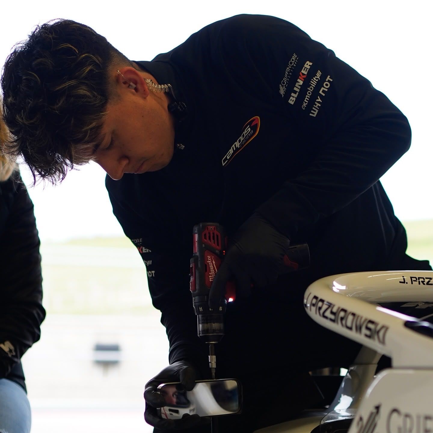 Bryan Ronquillo drilling on the halo of a Formula 4 car